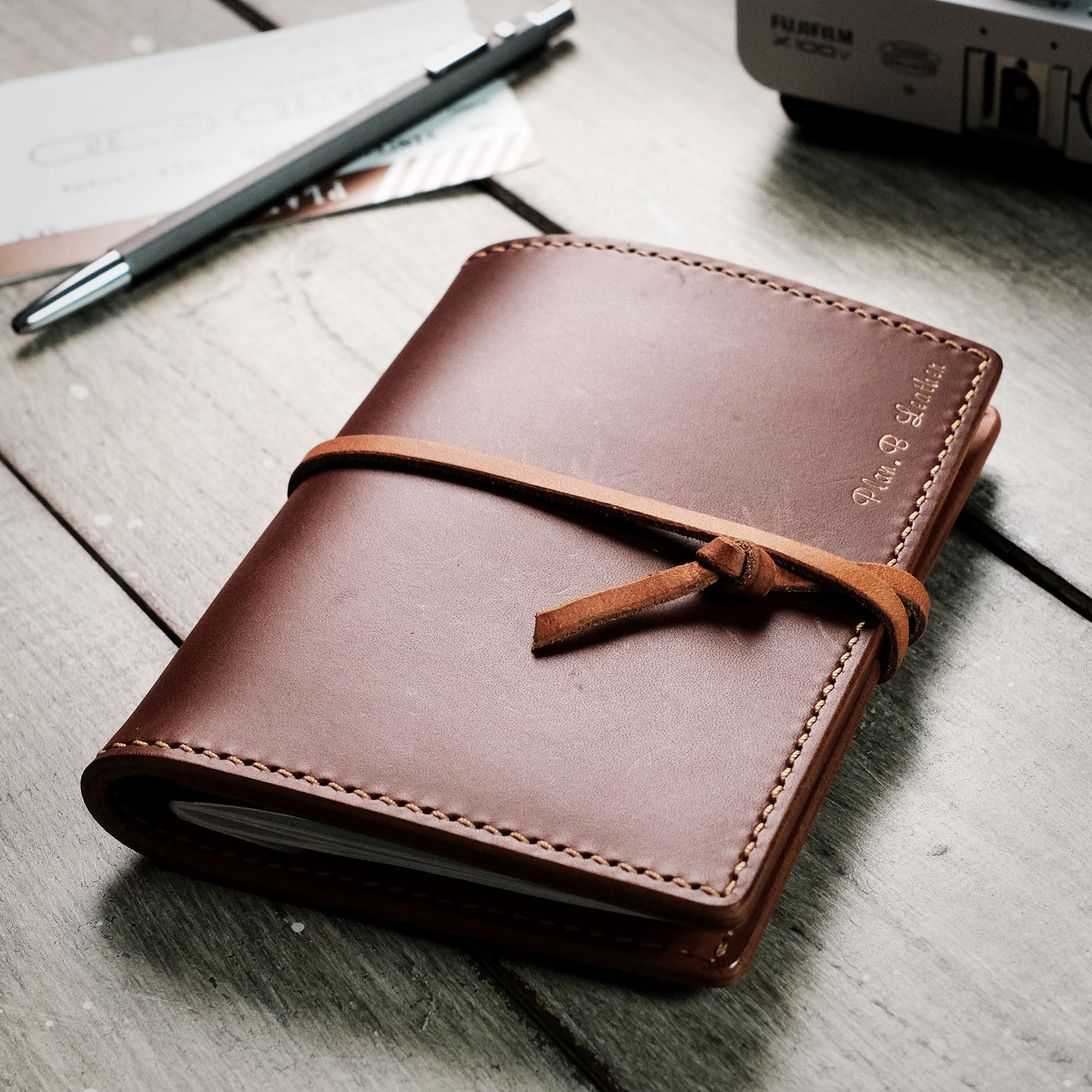 Angled front view of the passport wallet, showcasing its sleek design and compact structure.