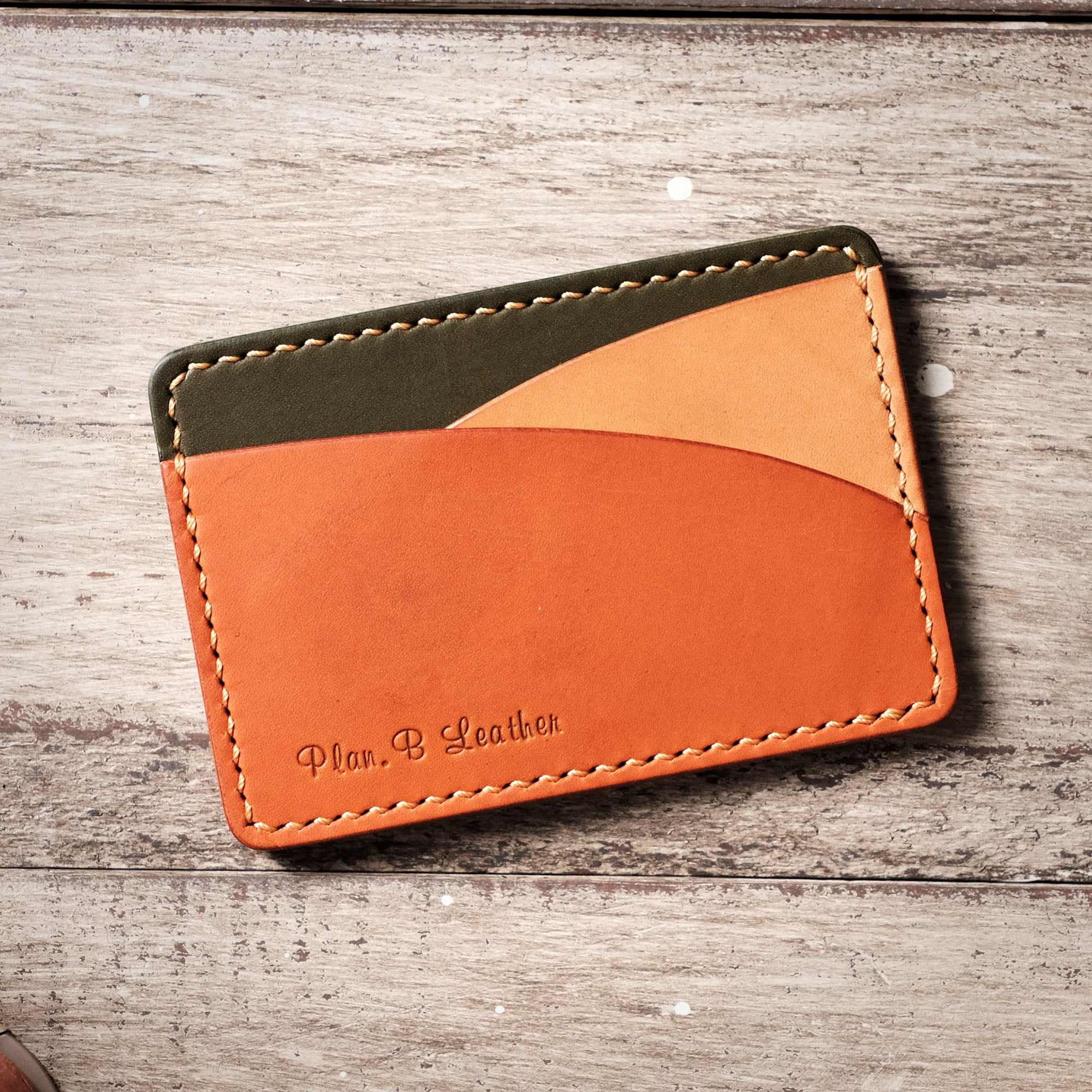 Front view of the Hills Card Holder without cards, showcasing its simple 3-pocket structure.