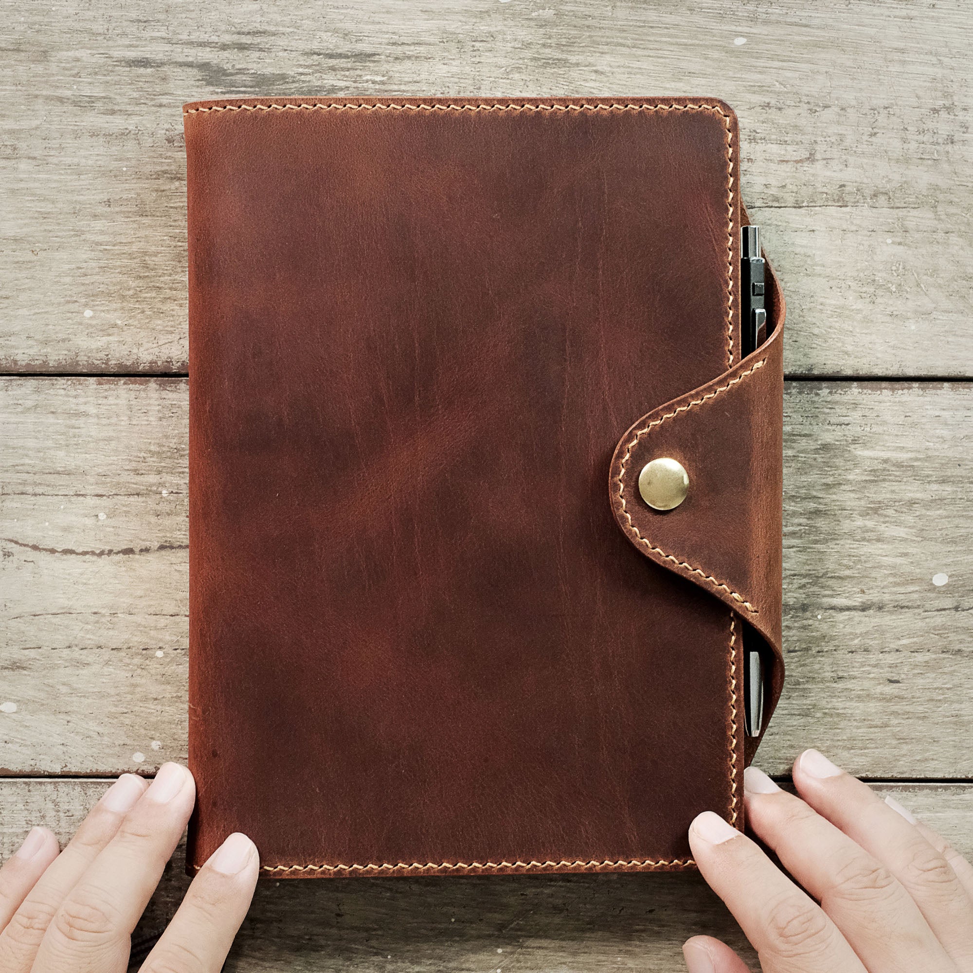 Close-up of the stitching on the A5 leather notebook cover.