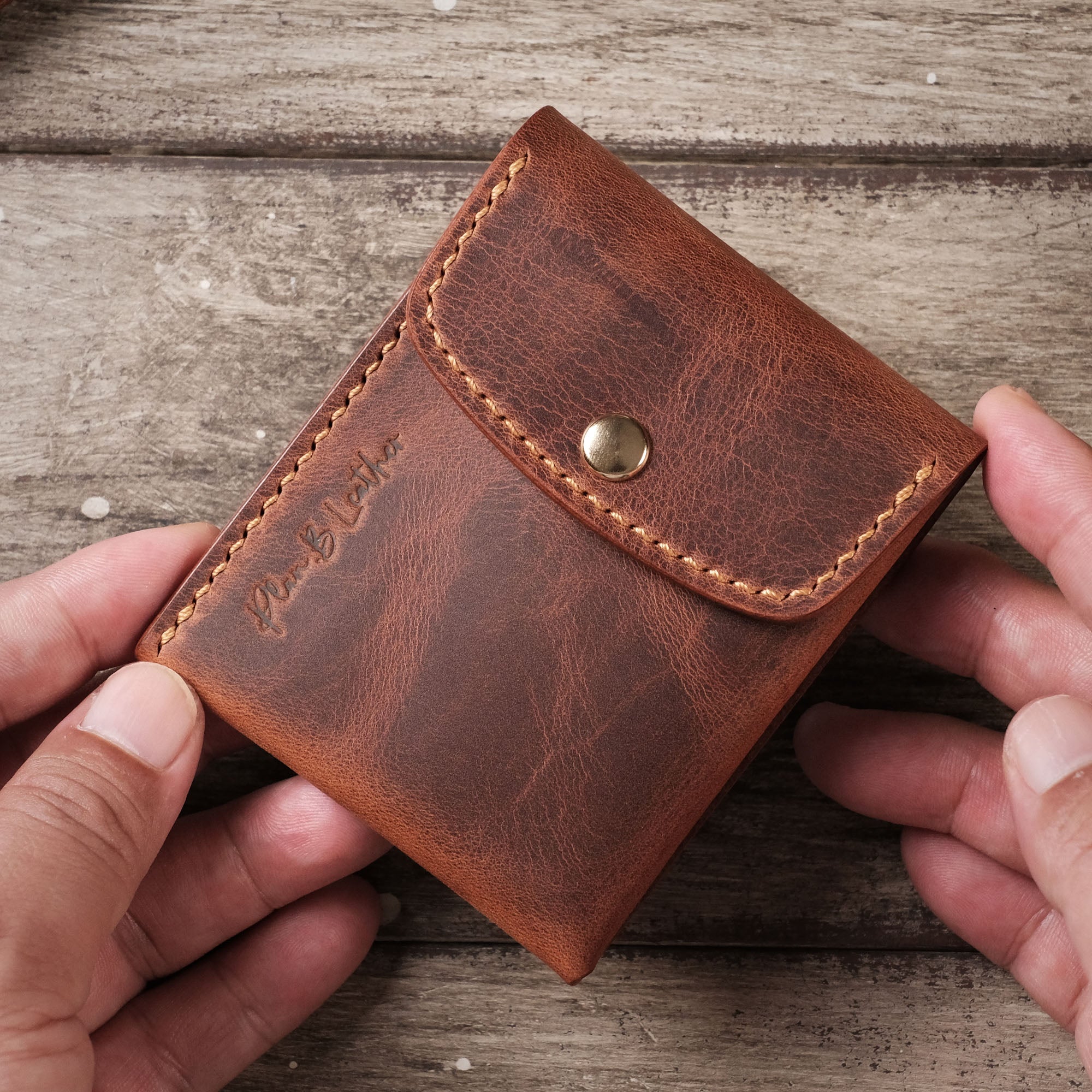 Front view of the Minimalist Wallet with Simple Structure resting on a hand.