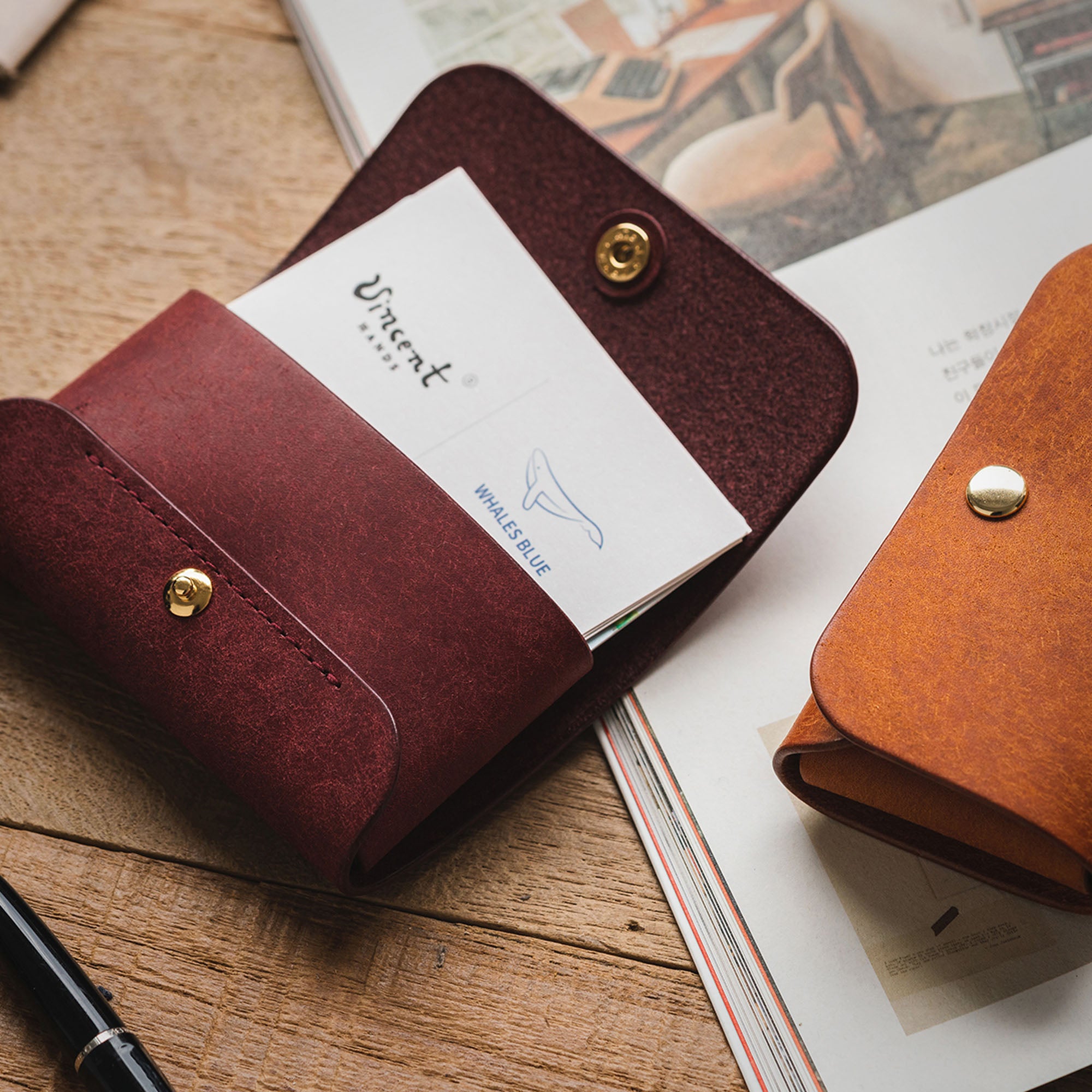 Brown and purple Business Card Wallets, showcasing their minimalist design and color options.