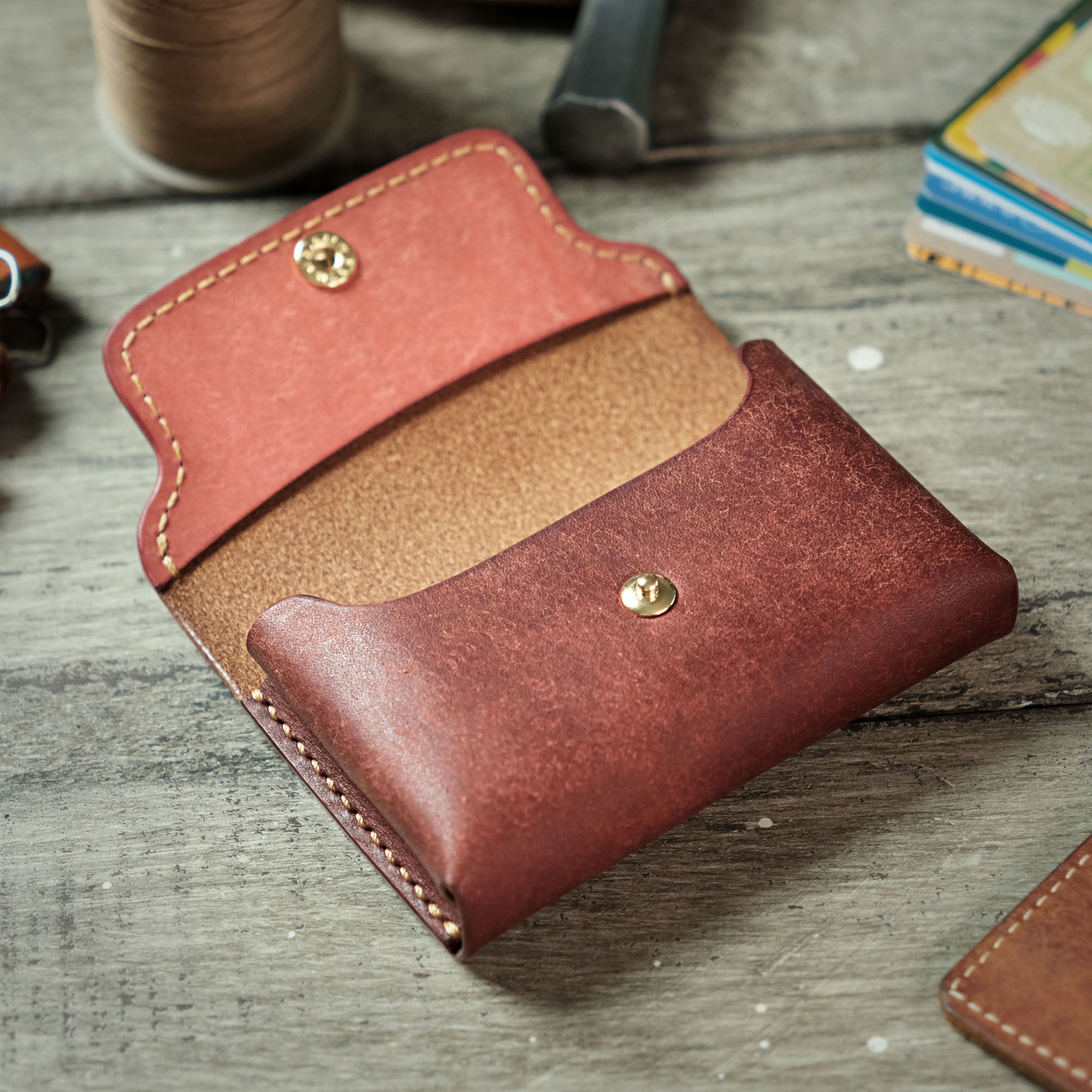 Compact Plump Wallet with the cover open, showcasing its spacious interior and hidden pockets.