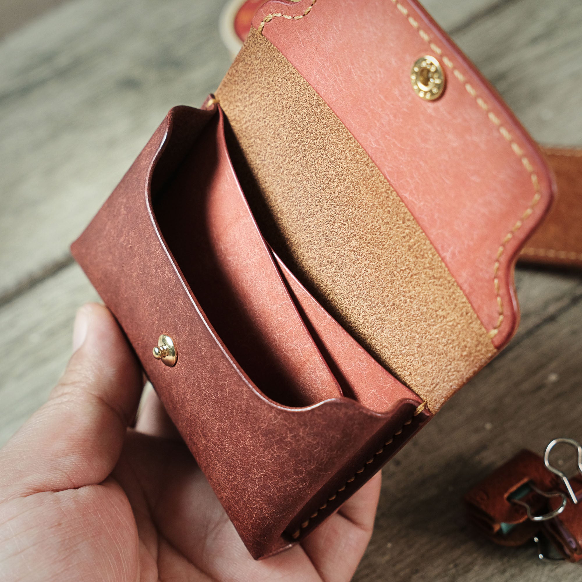 Interior view of the Compact Plump Wallet, displaying its spacious compartments and hidden pockets.