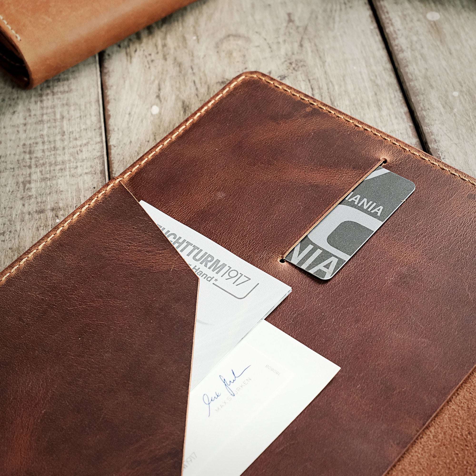 Detailed close-up of credit card slots and notepad compartment inside the A5 Notebook Cover.