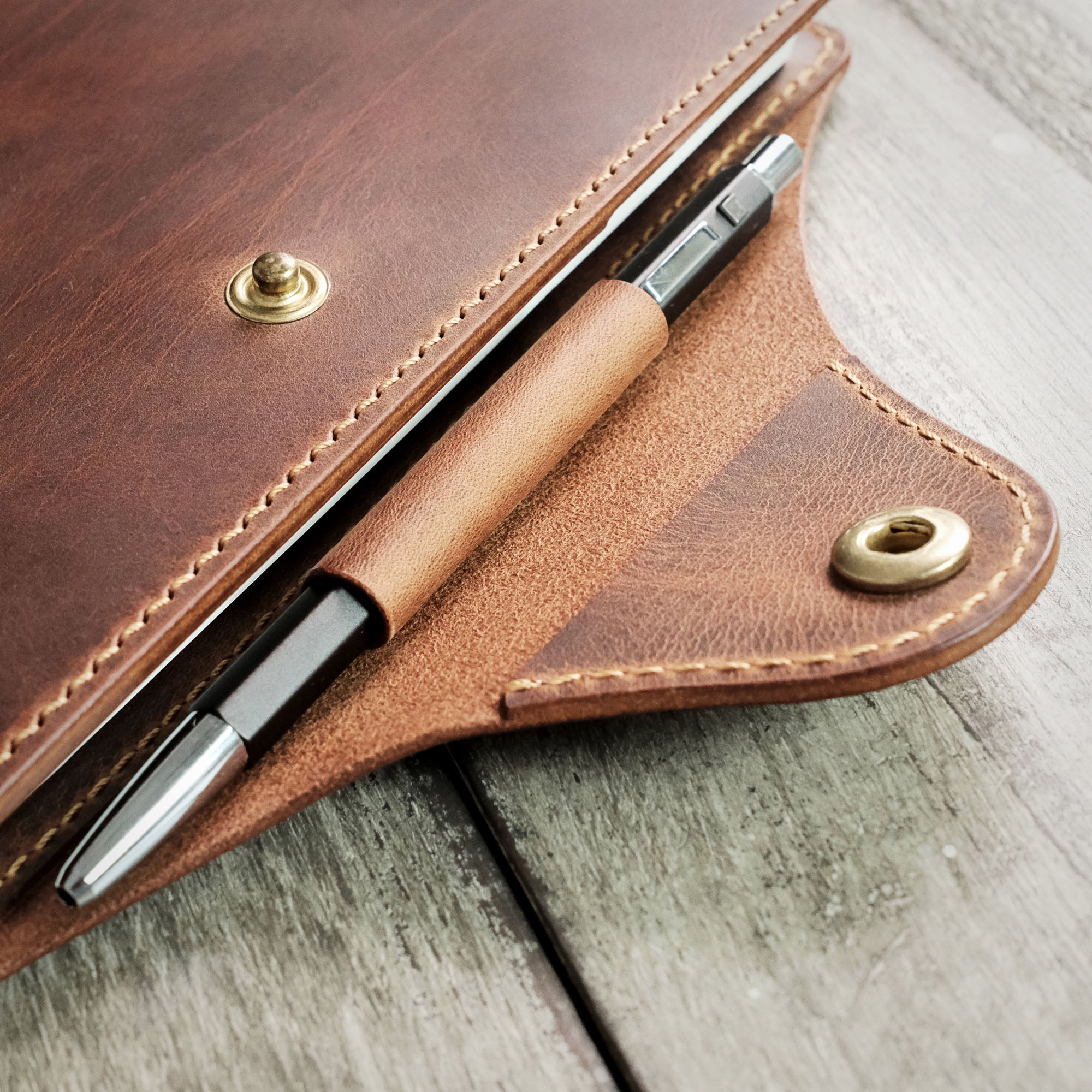 Detailed close-up of the pen loop with a pen inserted in the A5 Notebook Cover.